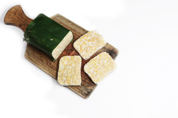 raw tempeh isolated white background, traditional indonesian food fermented soybeans