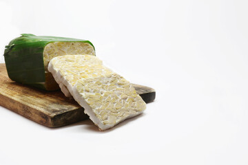raw tempeh isolated white background, traditional indonesian food fermented soybeans