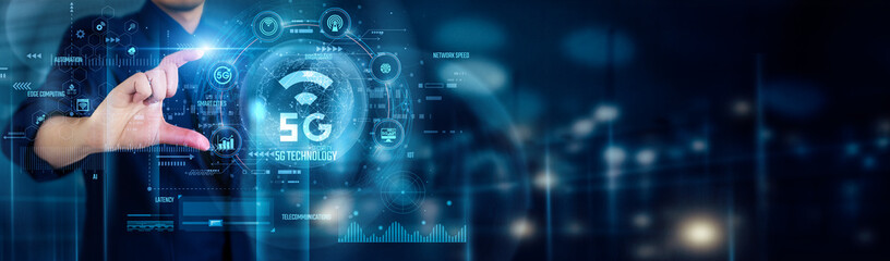 Businessman touching 5G TECHNOLOGY icons enables faster connectivity, enhances smart devices, supports IoT growth, improves network reliability, drives innovation in communication systems worldwide.