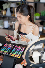 beauty blogger Young Asian girl makeup artist Professional Woman blogger vlogger is showing...