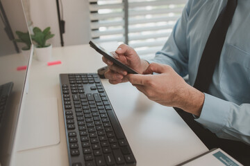 an entrepreneur is working diligently in an office, a businessman is using a smartphone to take a photo of a document, the manager is reviewing a document, marketing, company, accountant