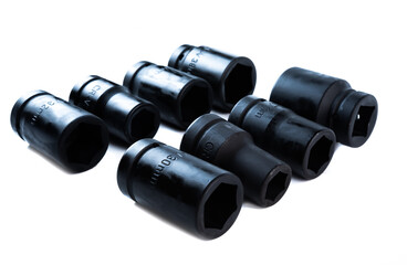 Set of heavy-duty impact sockets in various sizes arranged on a white background, ideal for automotive repair, mechanic shops, or garage tool kits.