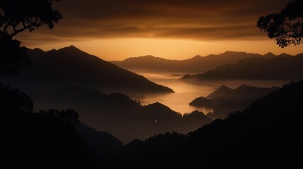 Obraz premium A scenic mountain range view during sunset with lake reflection