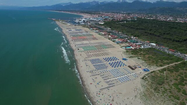 Aerial video documentation of the colorful umbrellas of Viareggio on a summer day.