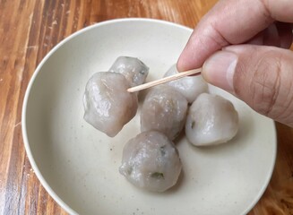 Food called sago ball or Cilok from Indonesia. Snack processed from sago served in plate.