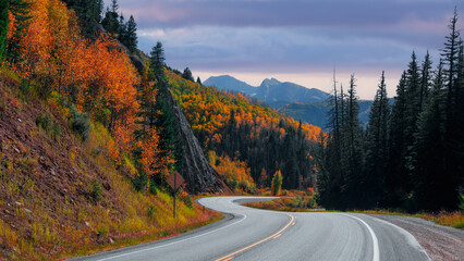 Scenic byway 133 in Colorado rocky mountains with colorful foliage during autumn time .