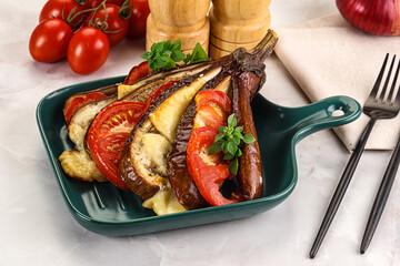 Baked tomato with mozzarella and tomato