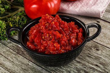 Diced ripe tomato with sauce