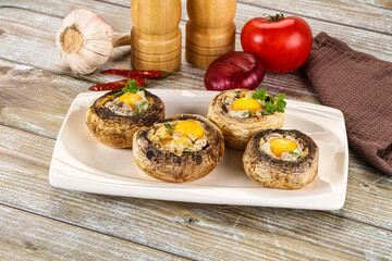 Baked champignon with quail egg