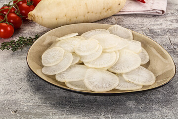 Sliced white daikon radish in the bowl
