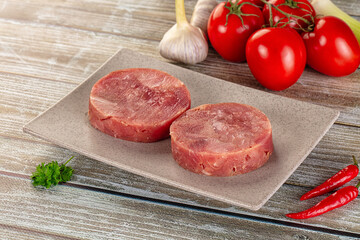 Raw round tuna fish fillet