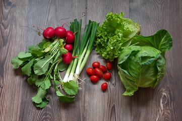 Top view of healthy vegetables on wooden background