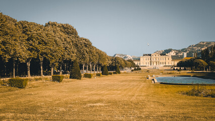 Panoramic golden view of Parc Borély and Château Borély, Borely Park, Marseille, Marseilles, France. Fine art summer landscape, trees and historical monument