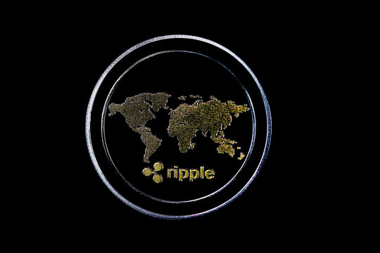 Detail of a cryptocurrency. XRP, Ripple. Black background