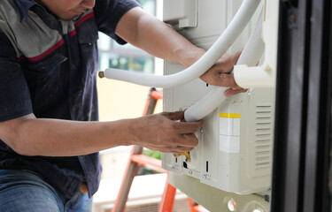 Repairman fix air conditioning systems, Technician service for repair and maintenance of air conditioners, Worker man install new air conditioners