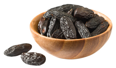 Black Tonka beans in the wooden bowl, isolated on white background.