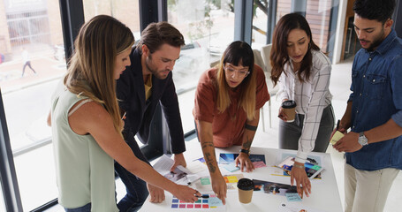 Group, creative business people and brainstorming with color palette for brand strategist. Team, manager and collaboration in startup office for planning, proposal and strategy for ad campaign design