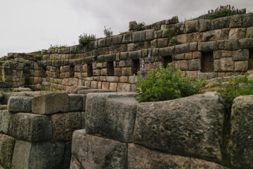 Wide view of the massive megalithic stone walls of the ancient Inca fortress Sacsayhuamán, located...