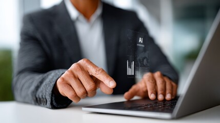 Fototapeta premium Man is using a laptop with a projection of a graph on the screen. He is pointing at the graph with his finger