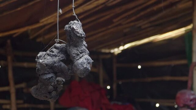 hanged charred pieces of flesh after post-mortem ceremony inside aghori shelter