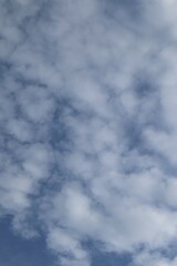 Serene Atmosphere, White Clouds Floating in Blue Sky on a Sunny Day