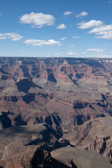 Panoramic views of the Grand Canyon, Arizona, USA, showcasing the dramatic landscape, layered rock formations, and vivid colors under a clear sky. Perfect for travel and nature themes.