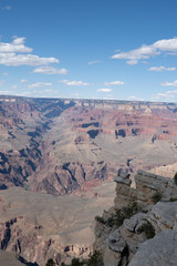 Panoramic views of the Grand Canyon, Arizona, USA, showcasing the dramatic landscape, layered rock formations, and vivid colors under a clear sky. Perfect for travel and nature themes.