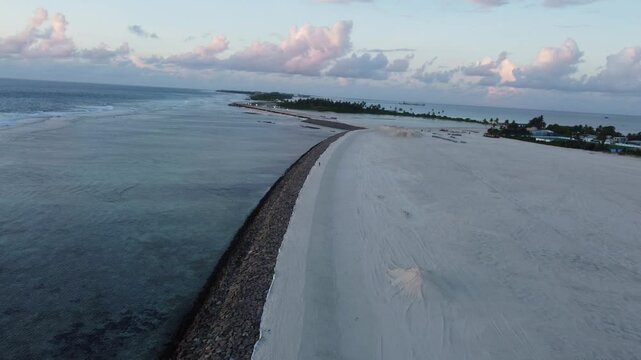 Aerial view of coastal development and road construction on Maradhoo Island, Addu Atoll, Maldives.