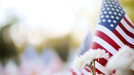 Solemn tribute at a military cemetery with American flags and flowers