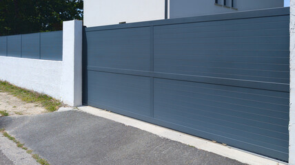 portal sliding modern grey classic metal home gate slide at entrance of house garden and small gray...