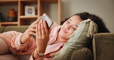 Woman, relax and smile on sofa for phone, online chat and match on dating website with contact. Home, female person and happiness with mobile for app, friend request and notification on social media