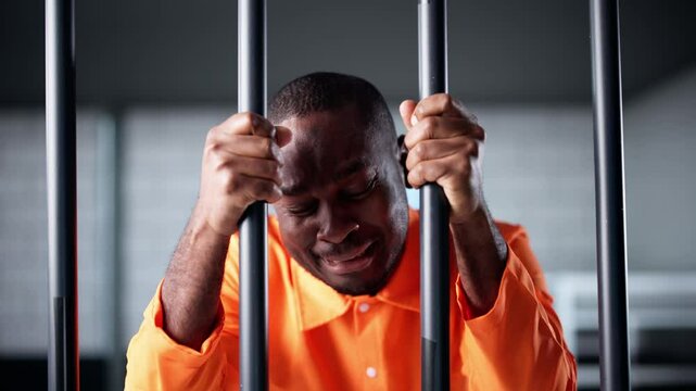 Sad Crying Prisoner Behind Bars In Jail Cell. Crime Punishment