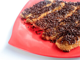 Pisang Goreng Krispi or crispy banana fritters sprinkled with chocolate or cereal.
 Indonesian food