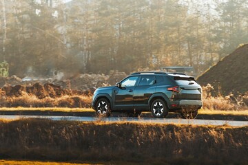 Fototapeta premium Luxury vehicle driving through countryside