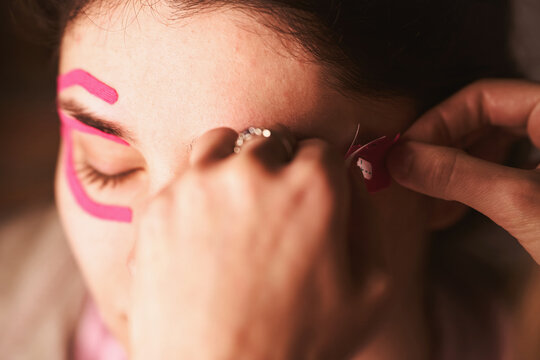 Young woman with medical face taping therapy