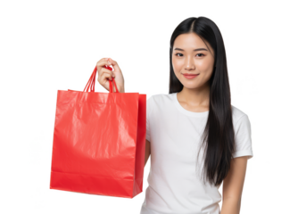 Isolated Portrait of Cheerful Young Asian Woman Holding Red Shopping Bag