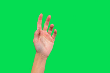 Hand reaching out against  bright green backdrop, showcasing fingers extended in a gesture of invitation or communication