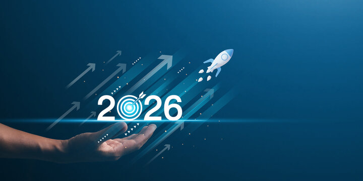 Businessman hand presenting with digital 2026 goal, rocket launch and upward arrows. Futuristic concept of business growth, digital strategy, and vision planning.