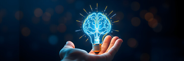 Hand holding a glowing brain inside a lightbulb representing creative ideas and innovation