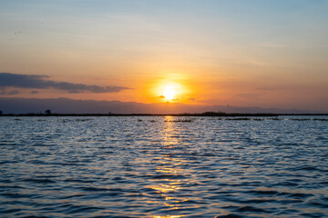 Sunset over Lake Tempe in Sulawesi, Indonesia's peaceful waters