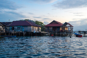 Fishermen houses at sunset, Pulau Papan, Malenge, Sulawesi, Indonesia