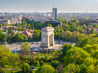 Aerial Bucharest. Arch of Triumph, Kiseleff boulevard and Herastrau Park in an aerial photo taken in the north part of Bucharest, Romania, during a summer day. Bucharest from above.