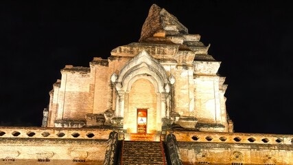 Historic Temple Structure Illuminated at Night with Dramatic Lighting