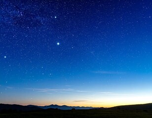 Fototapeta premium Starry night sky over a landscape