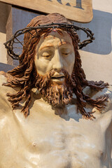 PIACENZA, ITALY - MAY 20, 2025: The detail of renaissance carved Crucifixioinin the Church Basilica...