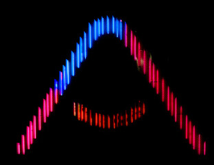 Letter A of the alphabet made from neon sign, against a black background