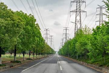 power pylon and transmission line along the street