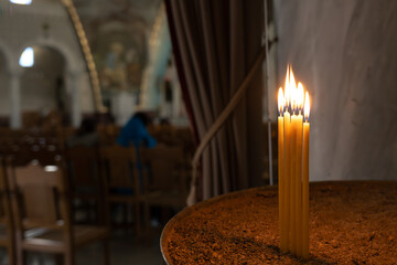Candles at the entrance of the church