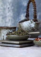Dried Green Tea Leaves on Bright Background. Close up.	
