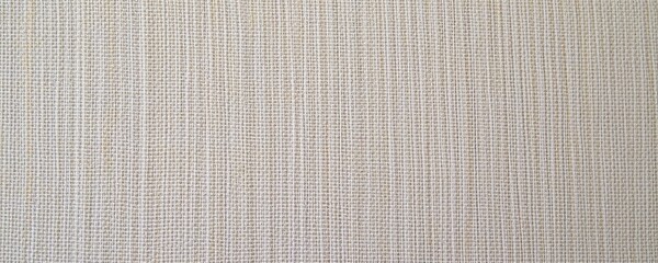 close up of linen canvas with warm lighting, soft and textured background